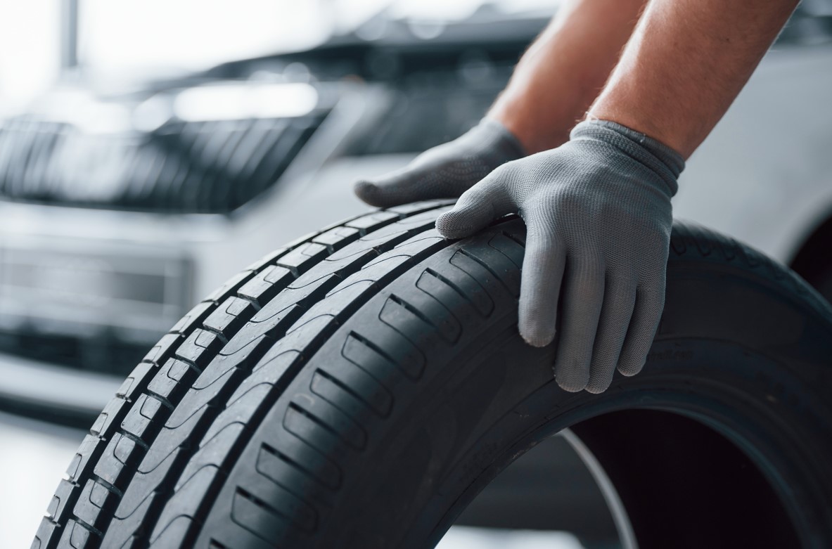 Mechanic holding a tire