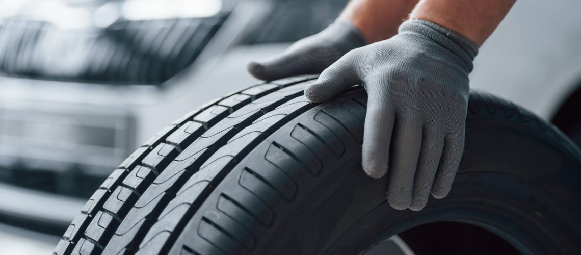 Mechanic holding a tire